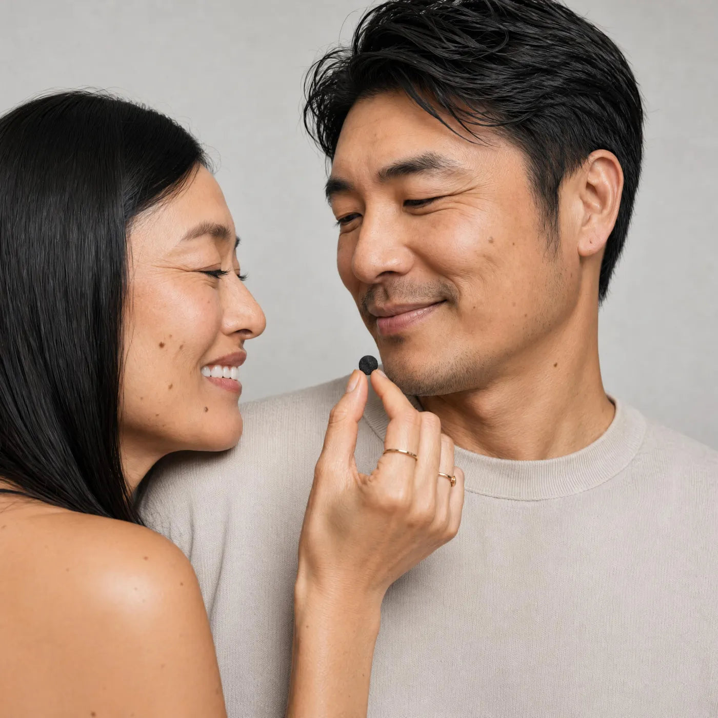Couple sharing a shilajit tablet